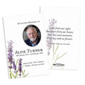 Two white memorial cards with lavender floral illustrations and printed remembrance text, shown overlapping on a white background. One card includes a circular portrait photo and the other shows a poem with a placeholder brand logo at the bottom.