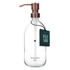 Clear glass bottle with copper pump and 'Kushi' label on a white background