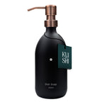 Black dish soap bottle with copper pump and 'KUSH' label on a white background