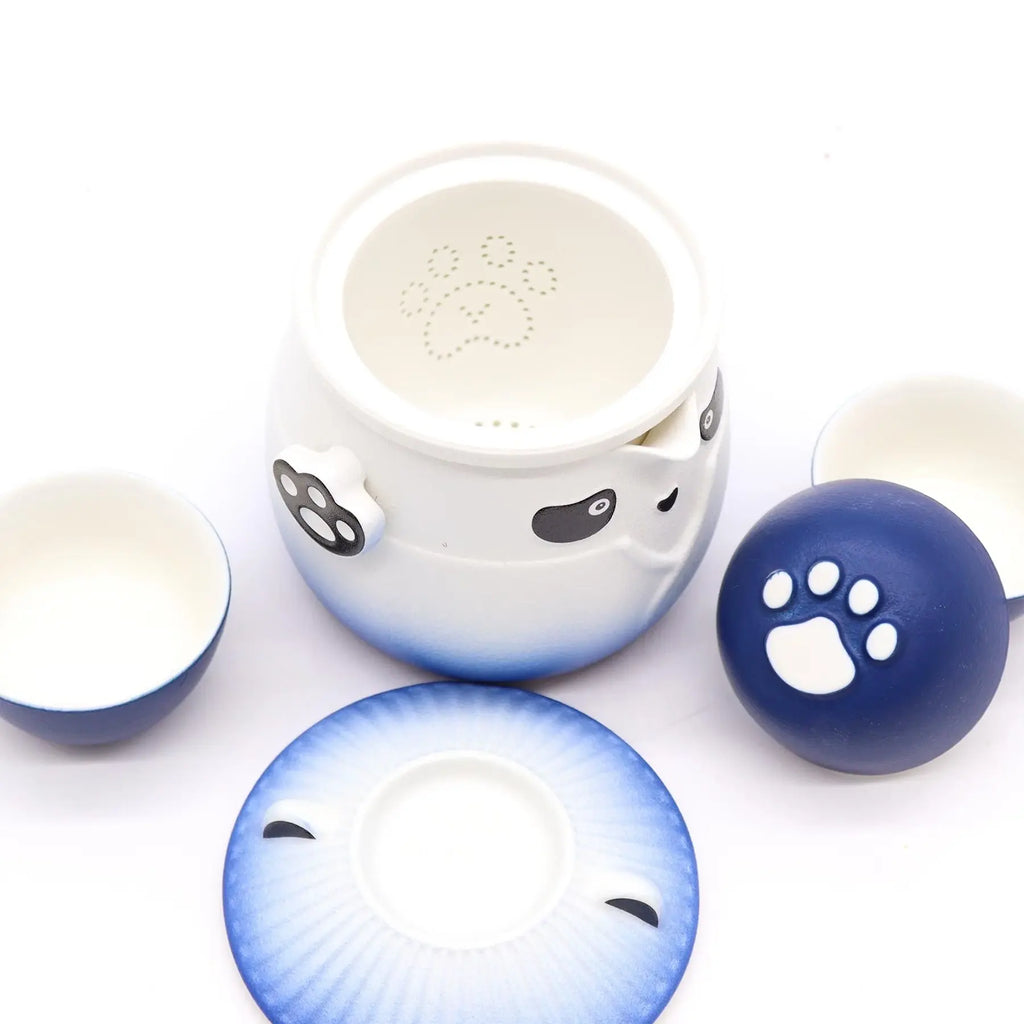 Set of ceramic bowls with cat face designs on a white background