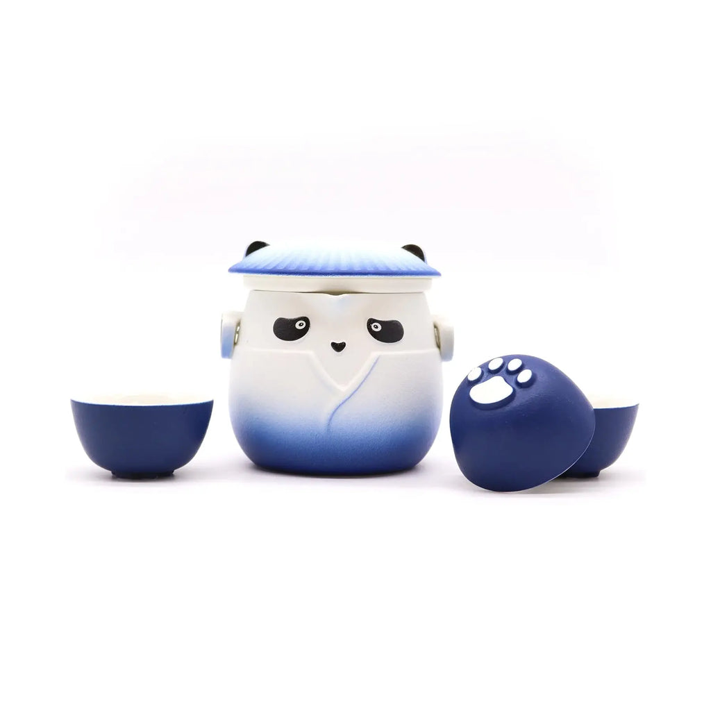 Ceramic teapot with panda design on a white background