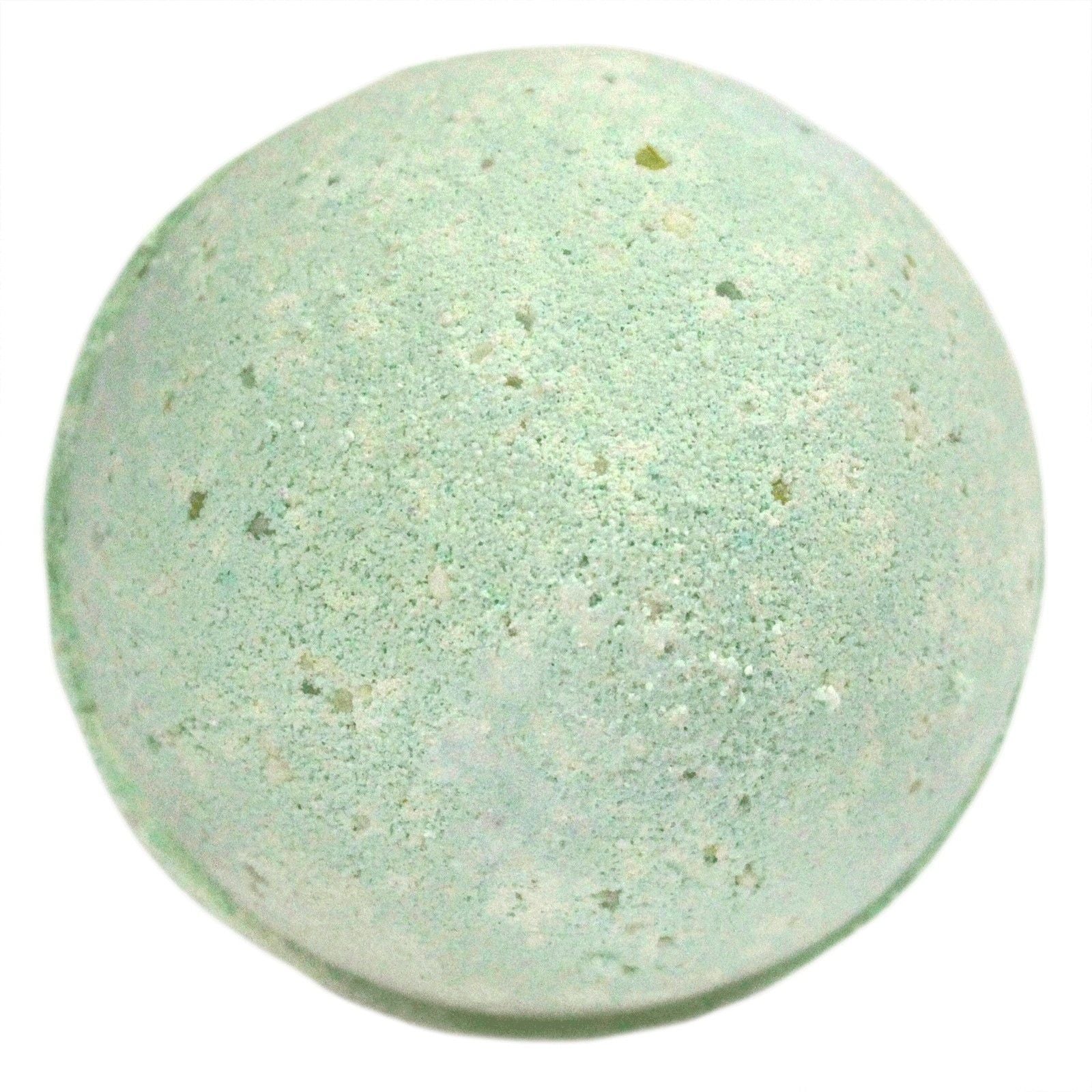 Green bath bomb with specks on a white background