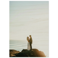 Couple embracing on a rocky outcrop with a scenic background wood print.