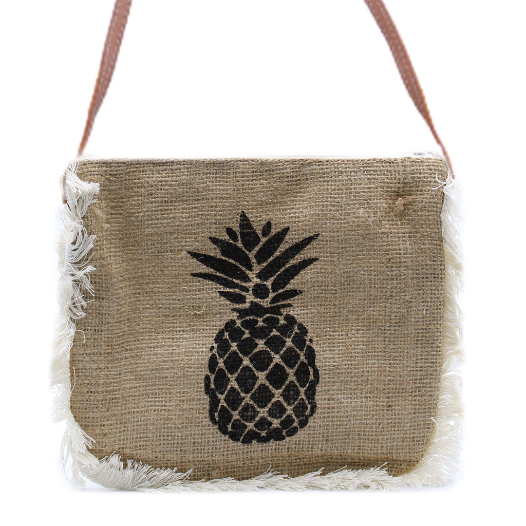 Jute bag with pineapple design and fringes on a white background