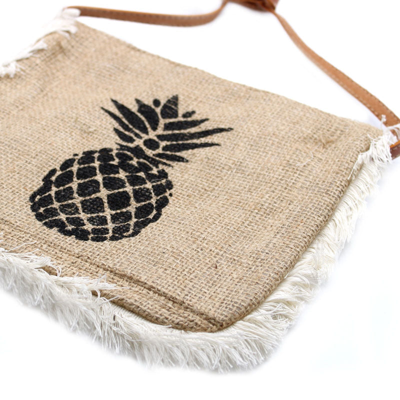 Jute bag with pineapple design and frayed edges on a white background