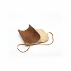 Rolled Leather Notebook – Natural Tan | Handcrafted A5 Journal (96 Pages) with a beige interior on a white background