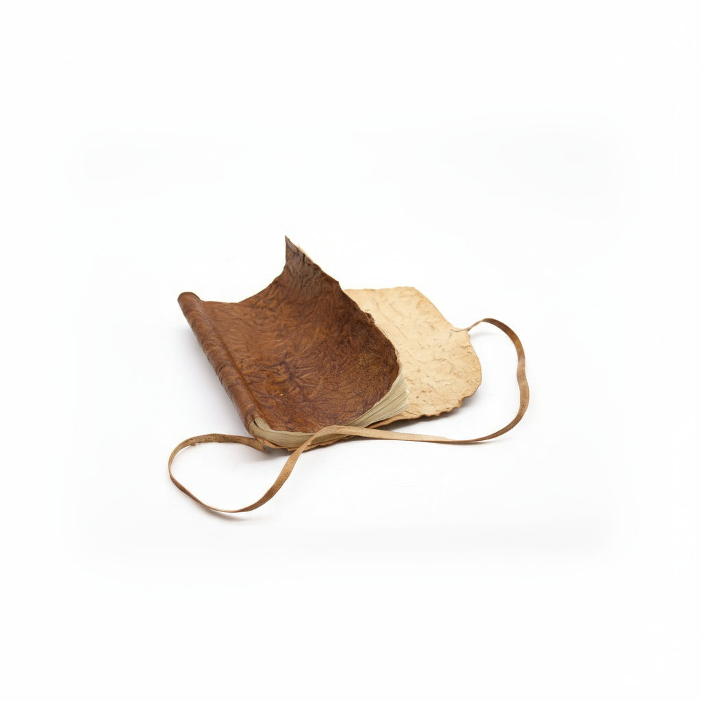 Rolled Leather Notebook – Natural Tan | Handcrafted A5 Journal (96 Pages) with a beige interior on a white background