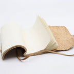 Rolled Leather Notebook – Natural Tan | Handcrafted A5 Journal (96 Pages) open book with natural paper and leather binding on a white background