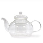 Clear glass teapot with a white lid on a white background