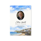 Memorial card with a photo of a man, text, and a coastal scene.