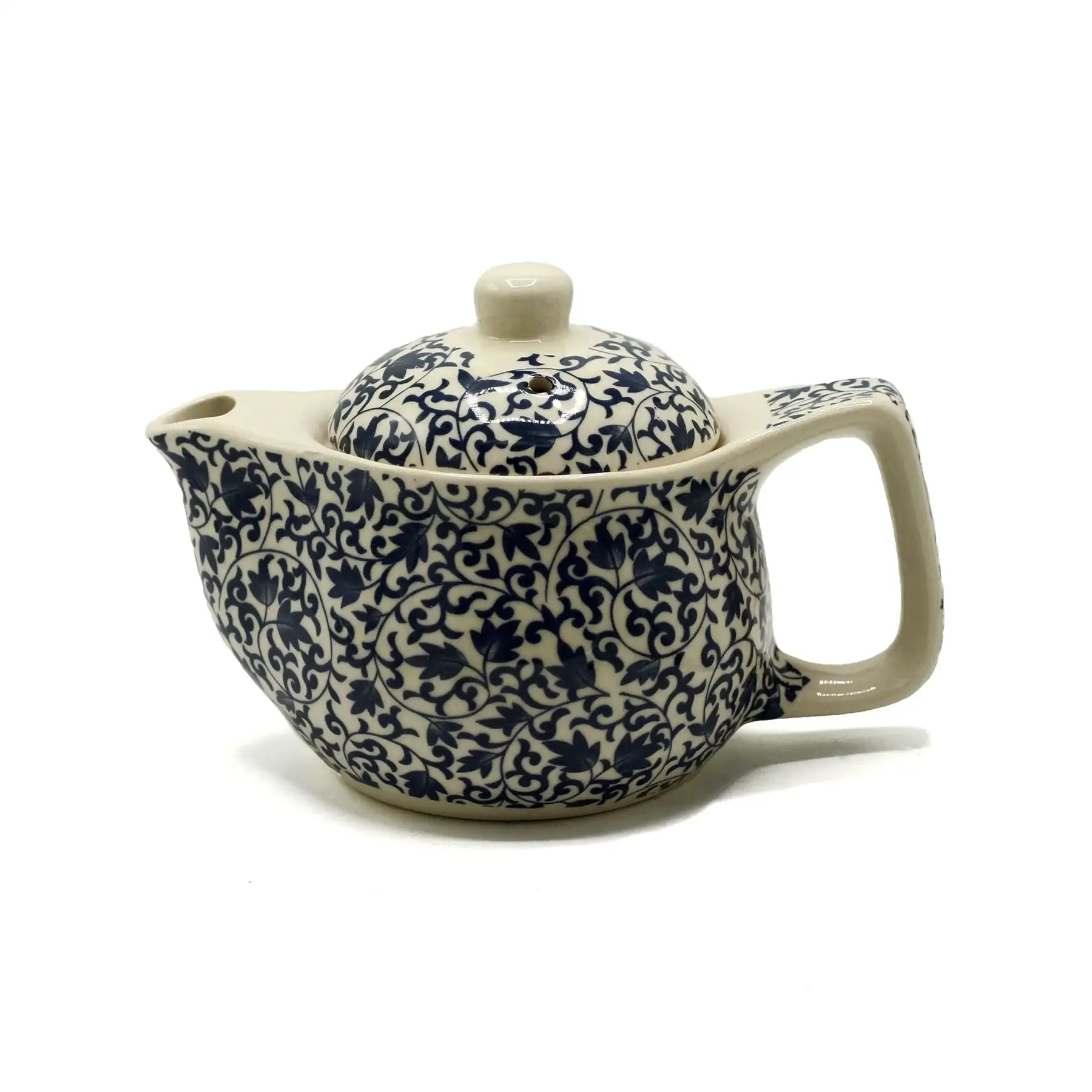 Ceramic teapot with blue floral pattern on a white background