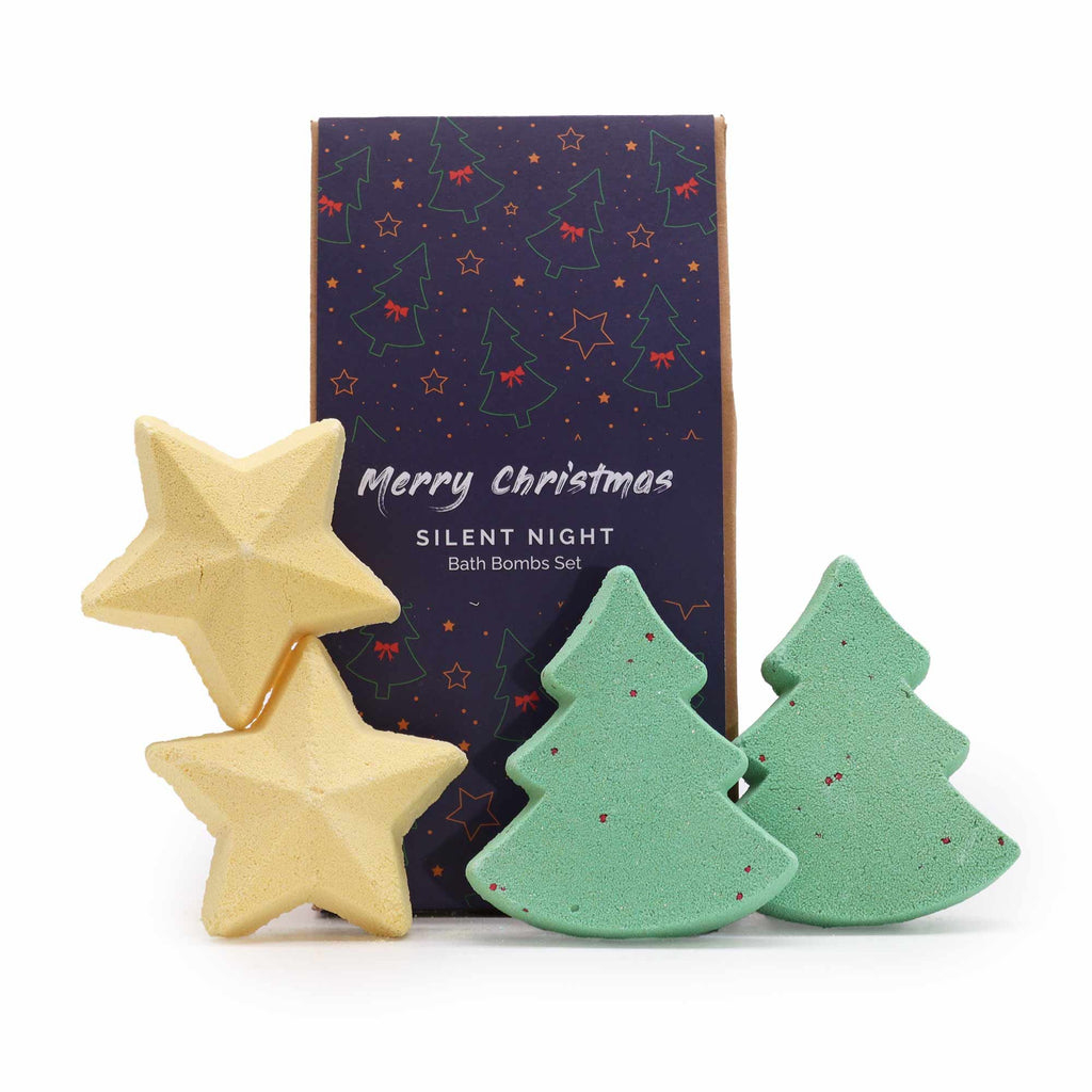 Christmas-themed bath bombs with star and tree shapes in front of a 'Merry Christmas Silent Night' box.
