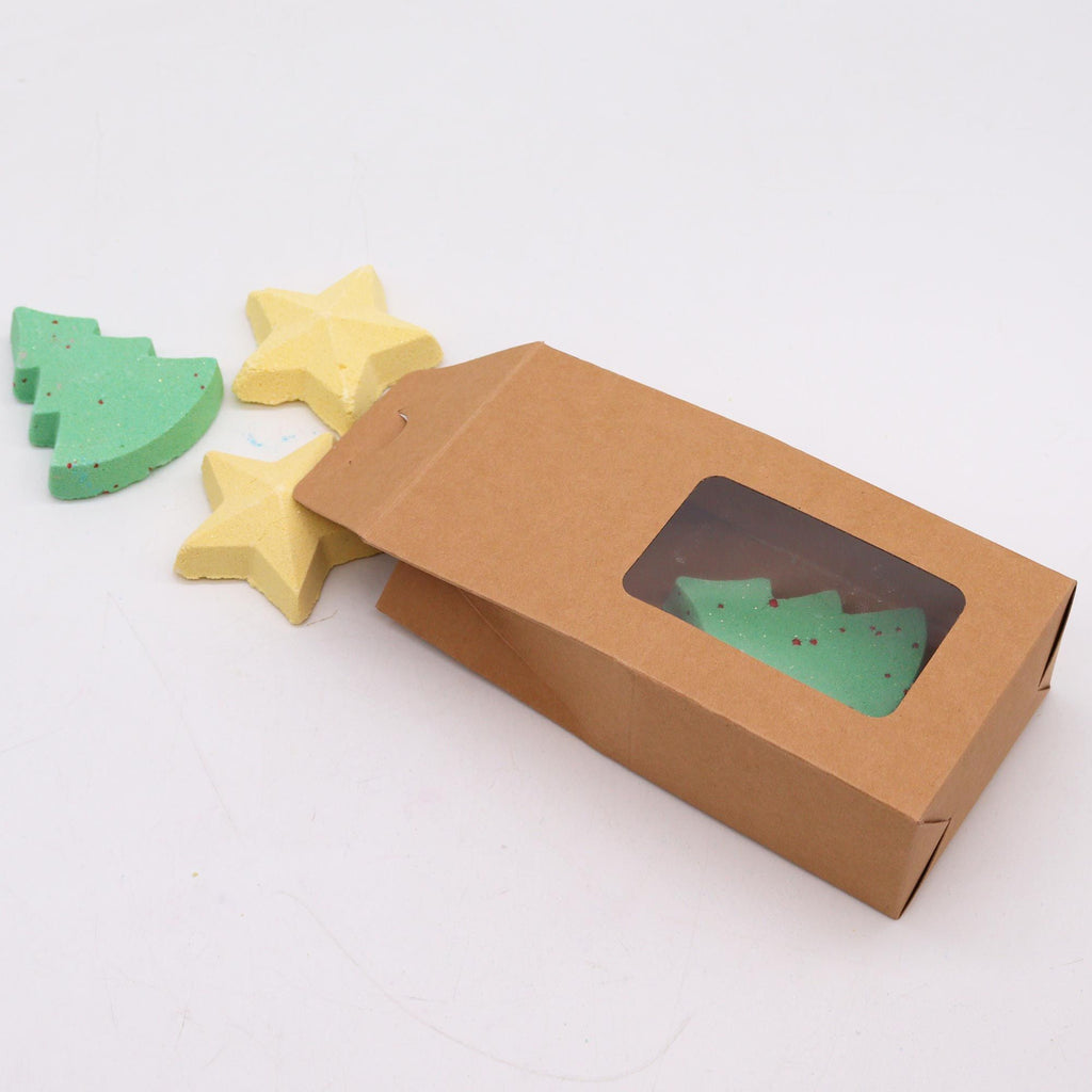 Carton box with window displaying green and blue tree-shaped objects on a white background