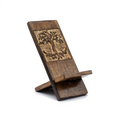 Wooden phone stand with engraved design on a white background