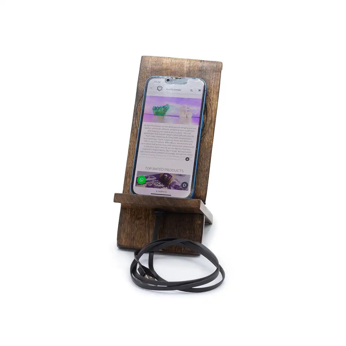 Wooden phone stand holding a smartphone on a white background