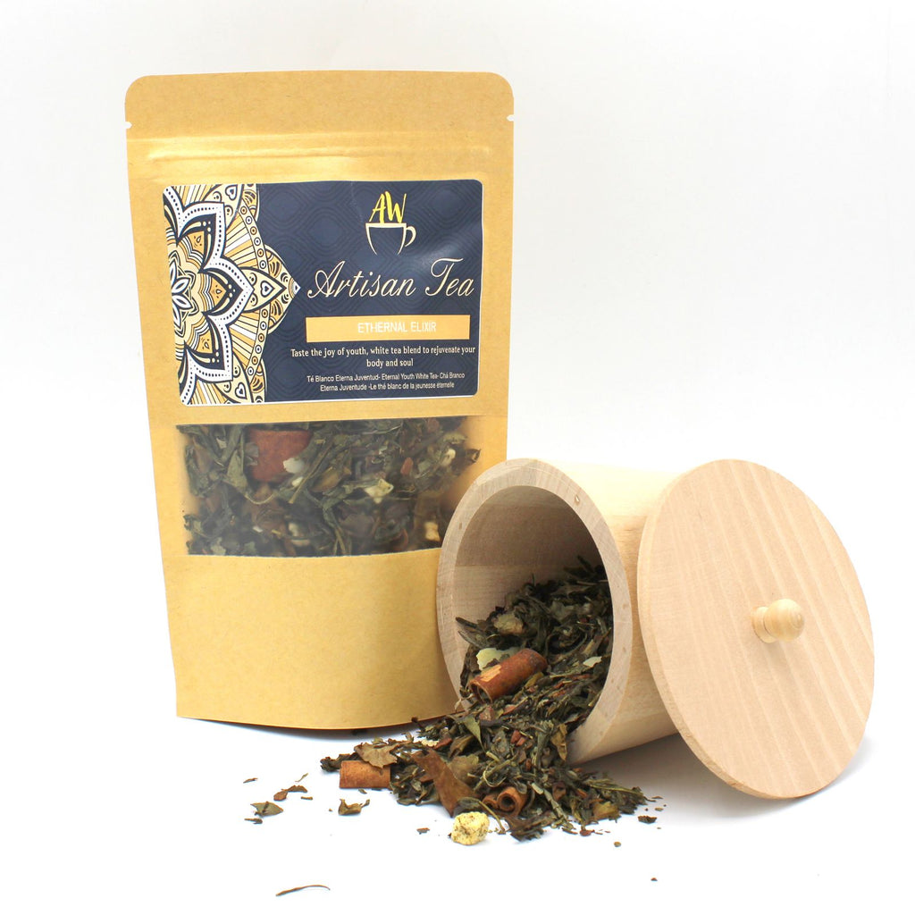 Artisan White Tea with Sencha, Apple & Cinnamon - 50g packaging with a wooden container of tea leaves on a white background