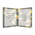 A three-panel folding service booklet or program cover shown open against a white background. The panels feature a blurred autumn leaf pattern in yellow, orange, and brown tones, with black text reading 'Order of Service' and service items on the left panel, and 'Eulogy', 'Committal', 'Closing Blessing', and 'Heretical Music' on the right panel.