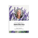 A memorial card design with a lavender field background, a circular portrait photo of a woman, and black text reading 'In Loving Memory of Jane Davies' with dates and service details below.