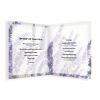 A lavender-themed order of service booklet shown open against a white background. The pages feature a soft purple and white floral design with black printed text outlining service steps, including procession music, welcome and introduction, prayer, reading, and communion music.