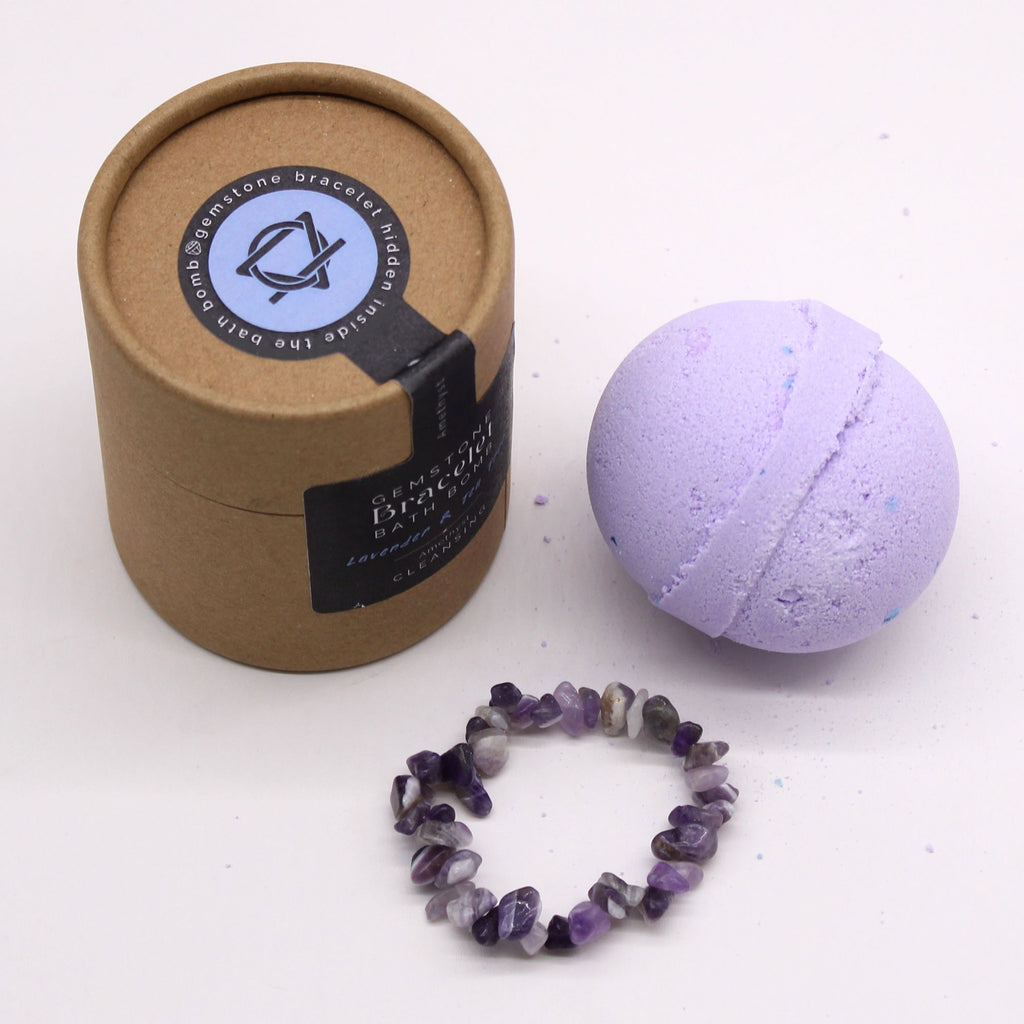 Bath bomb, bracelet, and packaging on a white background