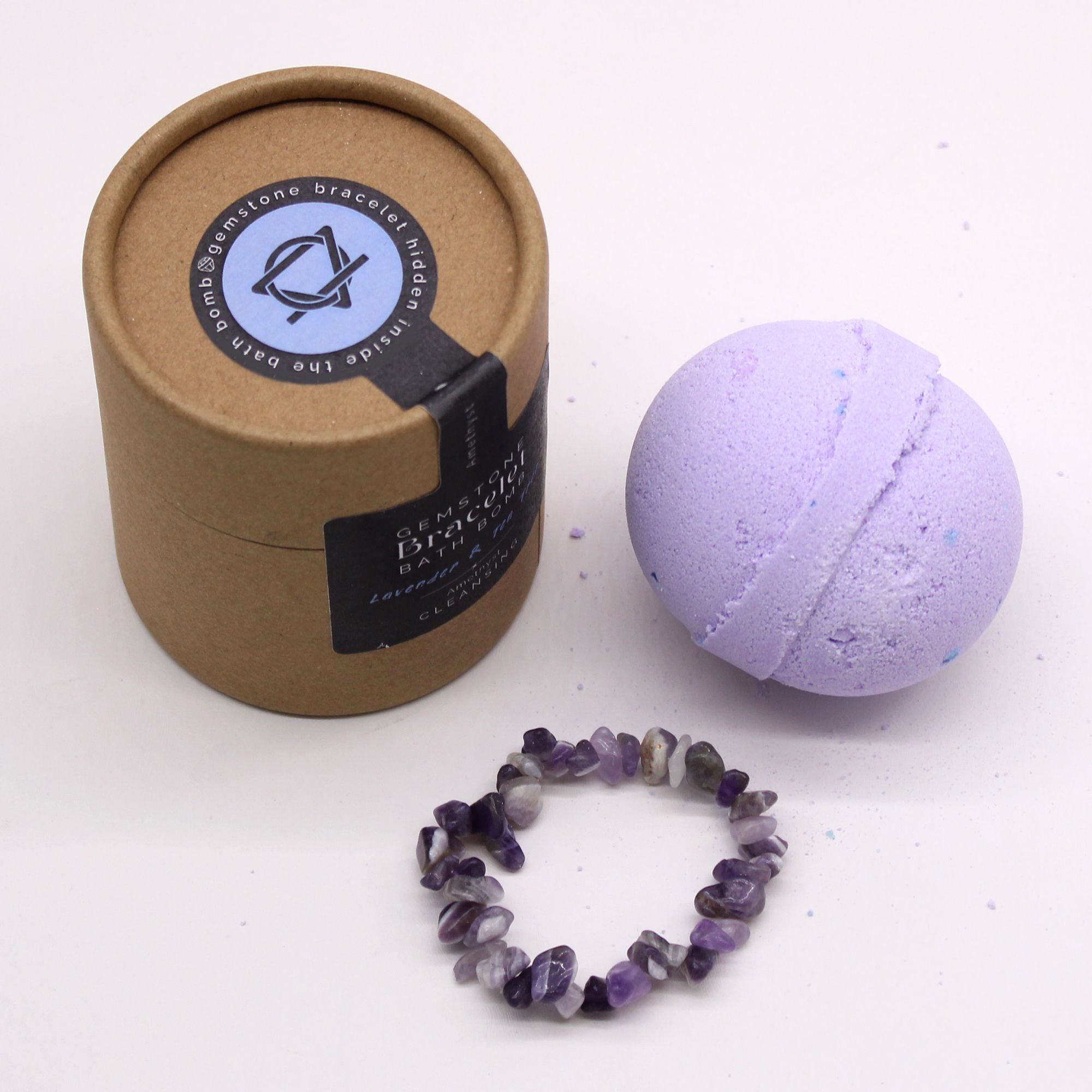 Bath bomb, bracelet, and packaging on a white background