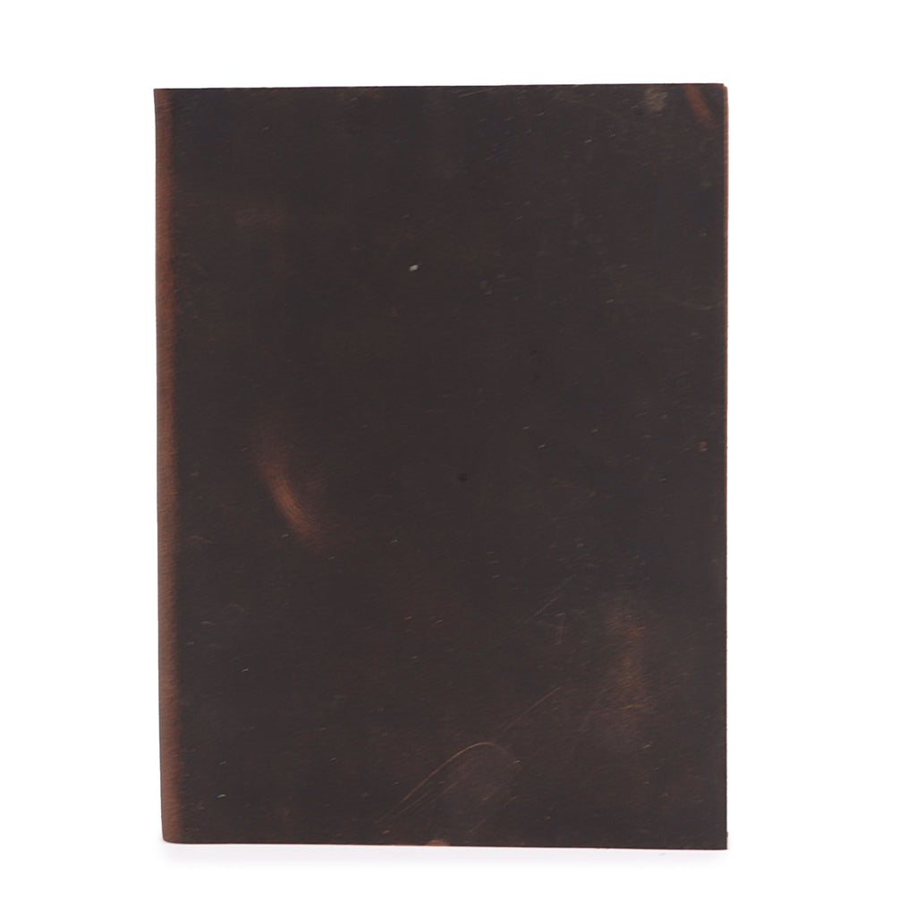 Dark brown leather-bound book on a white background