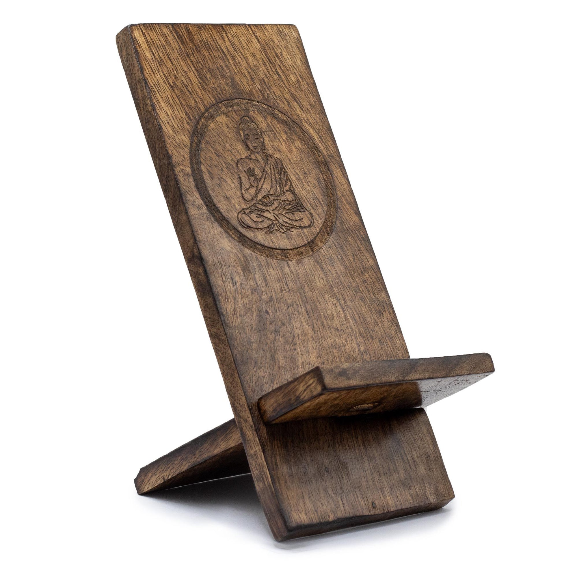 Wooden phone stand with Buddha engraving on a white background