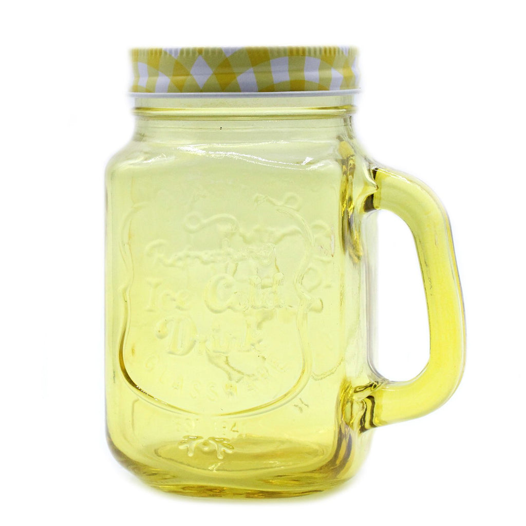 Yellow glass mug with handle and checkered lid on a white background