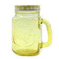 Yellow glass mug with handle and checkered lid on a white background