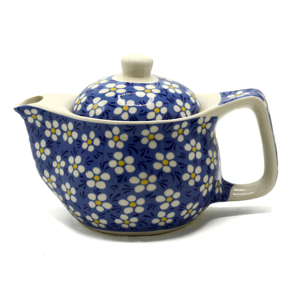 Ceramic teapot with blue floral pattern on a white background