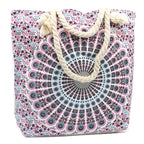 Floral patterned tote bag with rope handles on a white background
