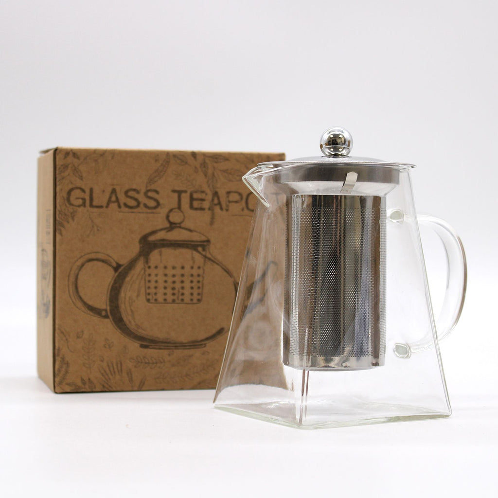 Clear glass teapot with metal infuser and brown box labeled 'Glass Teapot' on a white background