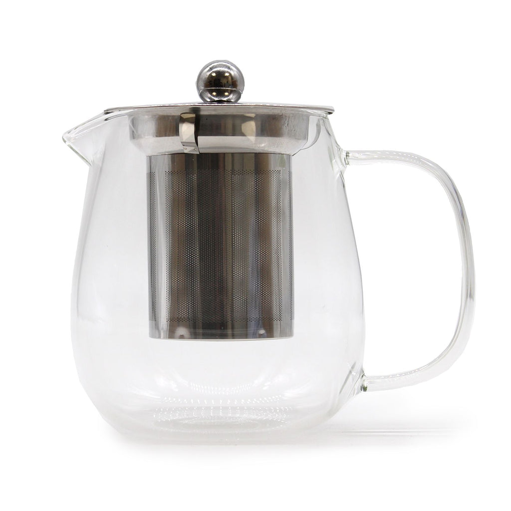 Clear glass teapot with metal infuser on a white background