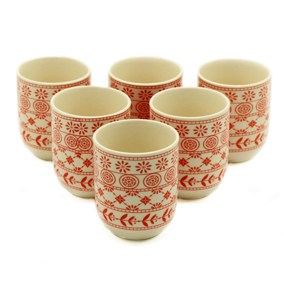 Set of six ceramic cups with red patterns on a white background
