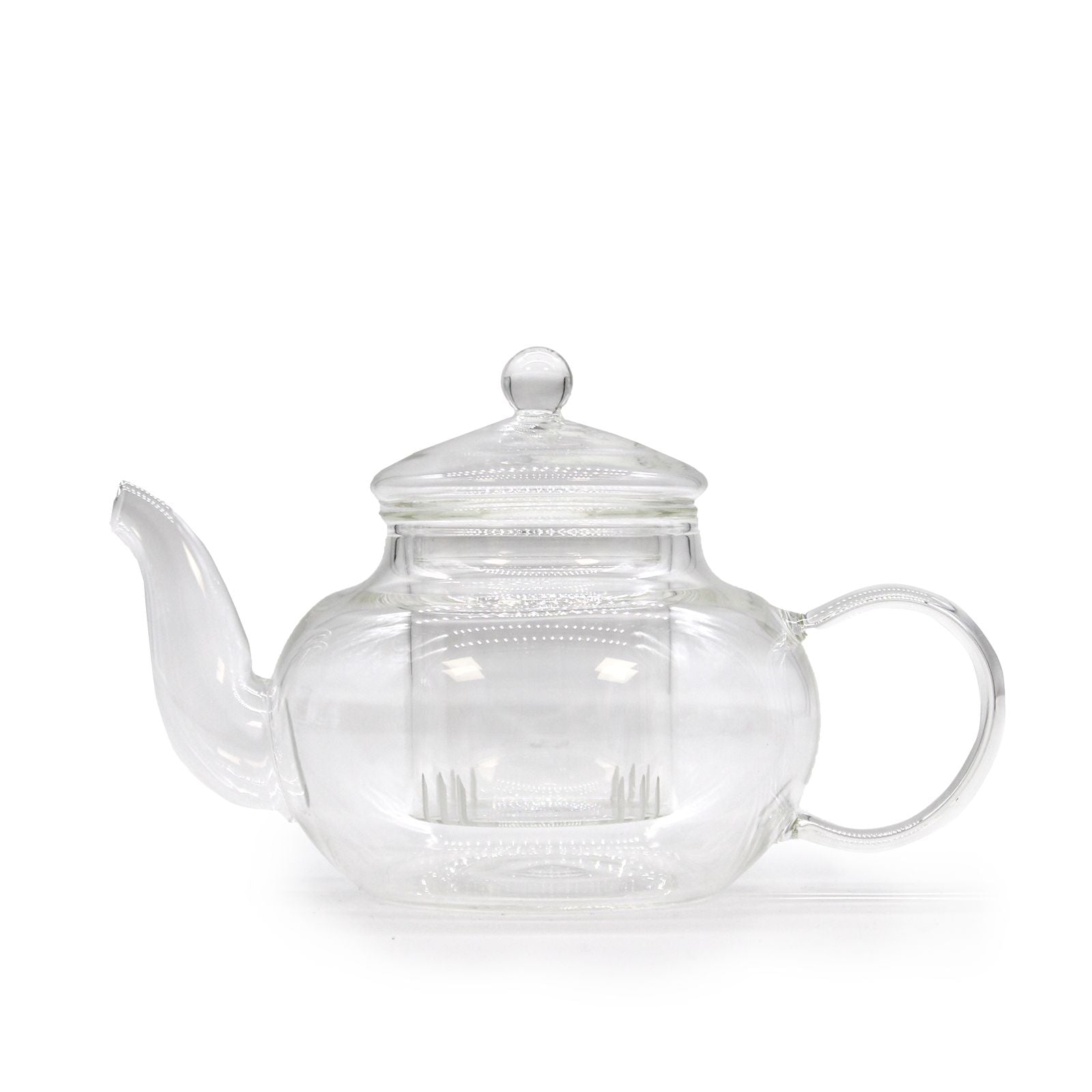 Clear glass teapot with a silver lid on a white background
