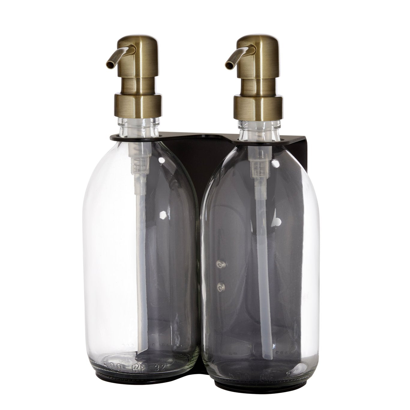 Two clear glass bottles with gold pumps in a black holder on a white background