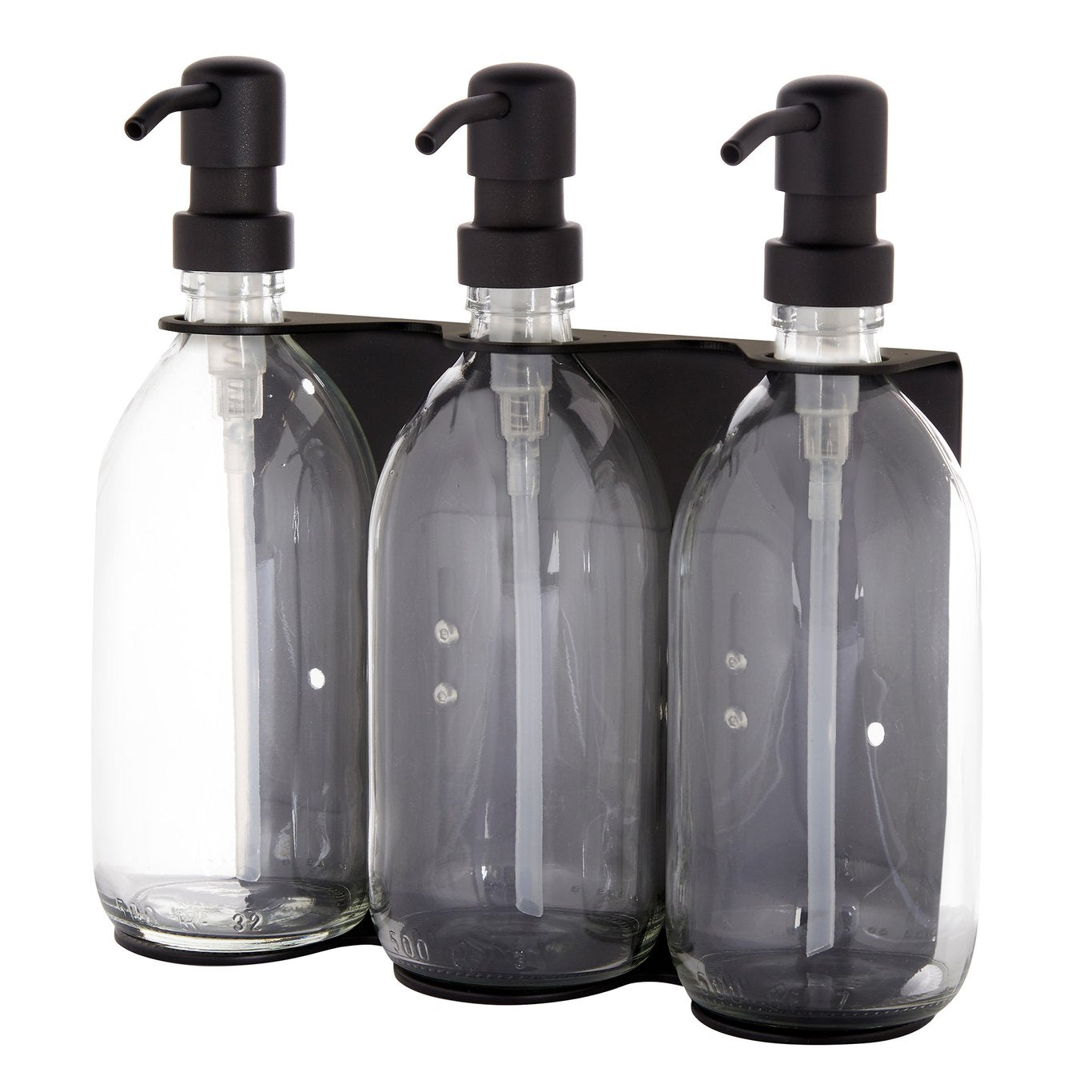 Three clear glass bottles with black pumps in a black holder on a white background