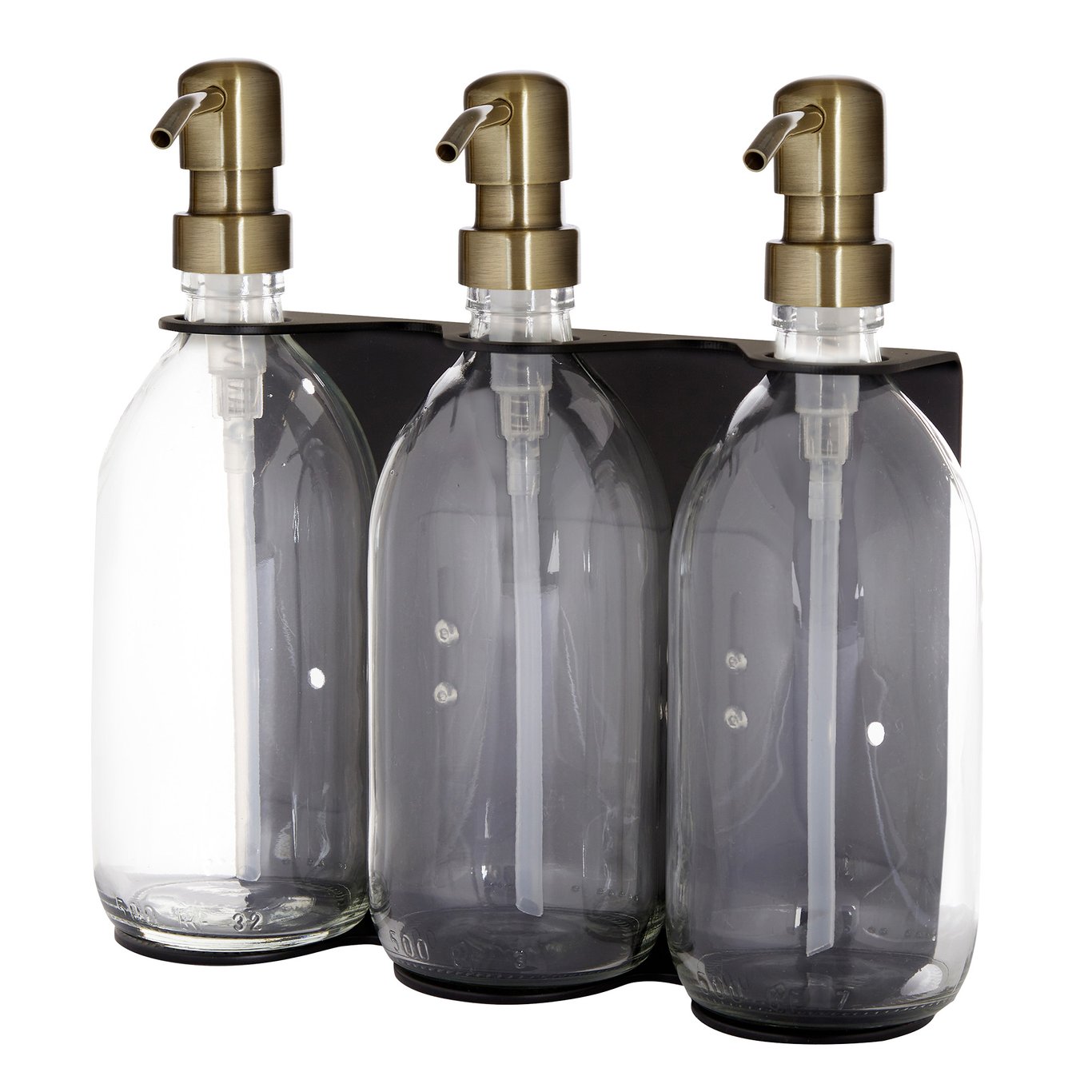 Three clear glass bottles with gold pumps in a black holder on a white background