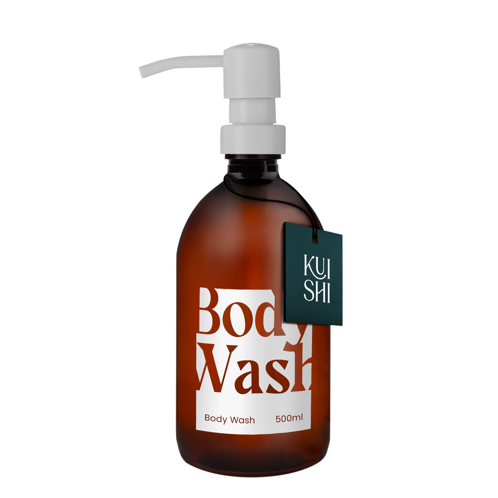 Brown bottle of body wash with pump and 'Kushi' label on a white background