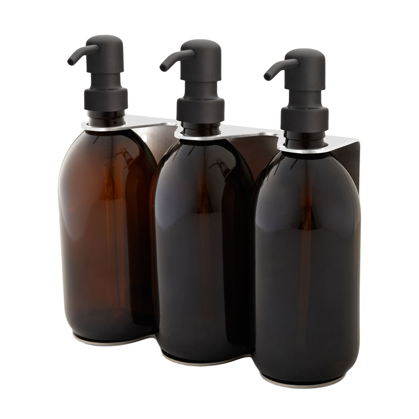 Three amber glass bottles with black pumps on a white background