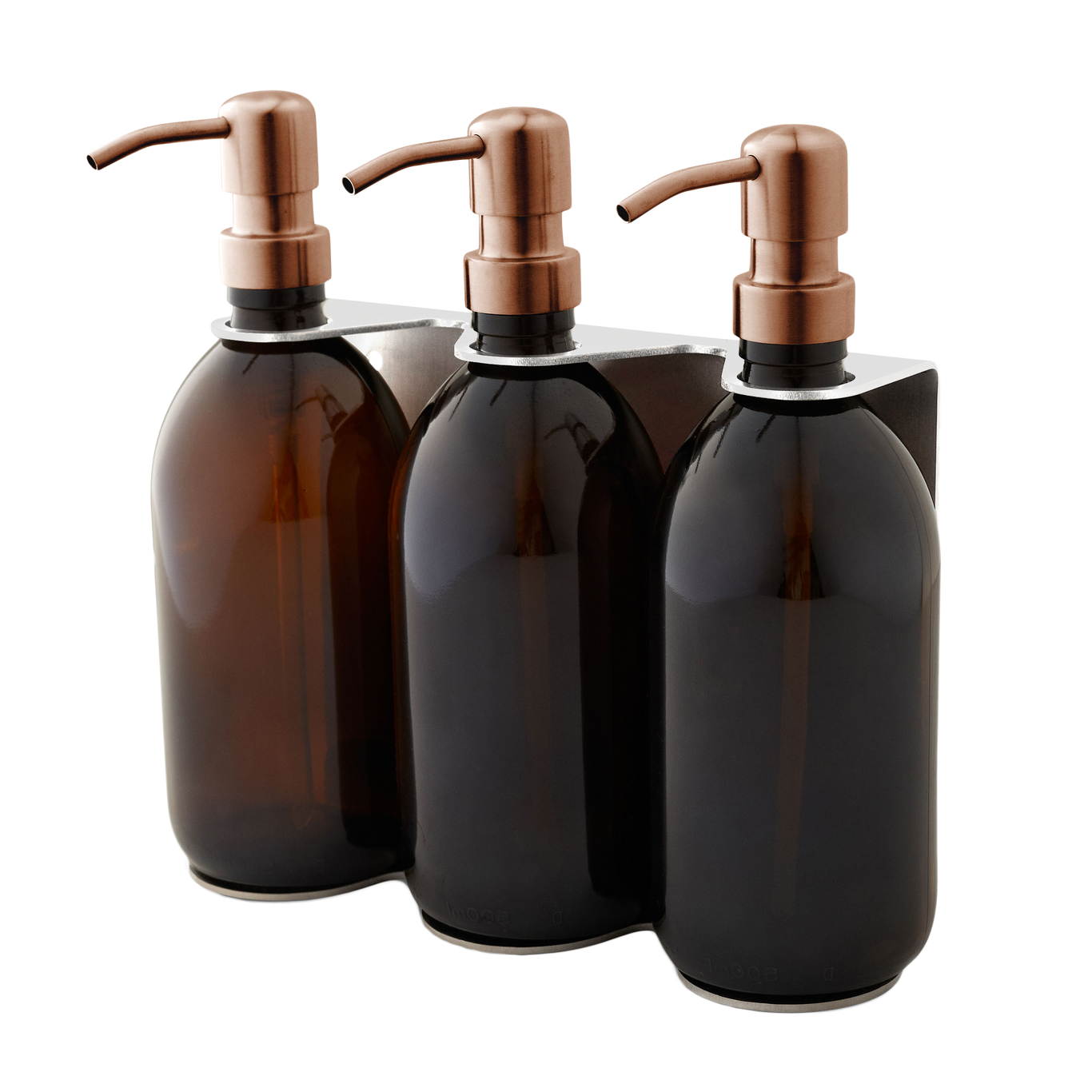 Three dark glass bottles with bronze pumps on a white background