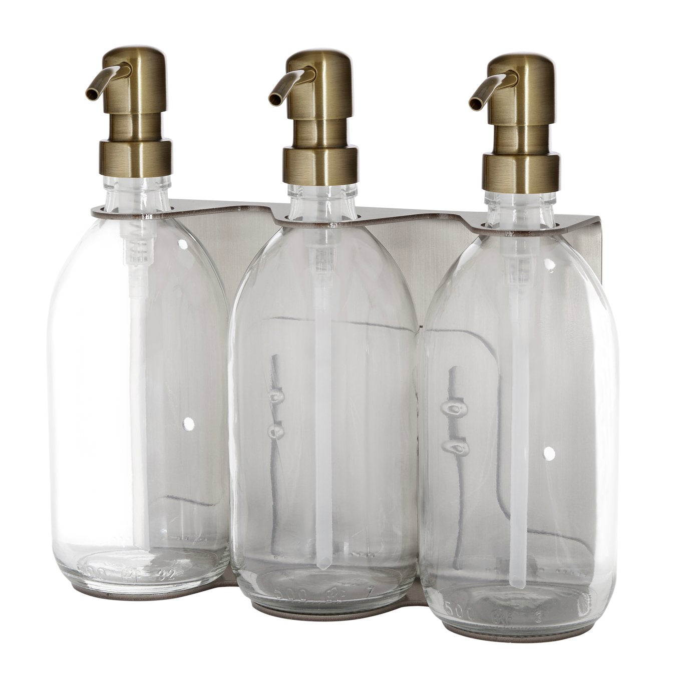 Three clear glass bottles with gold dispensers on a white background