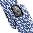 Phone case with blue and white wave pattern on a white background and close up