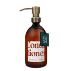 Brown conditioner bottle with pump and 'KUSHI' label on a white background