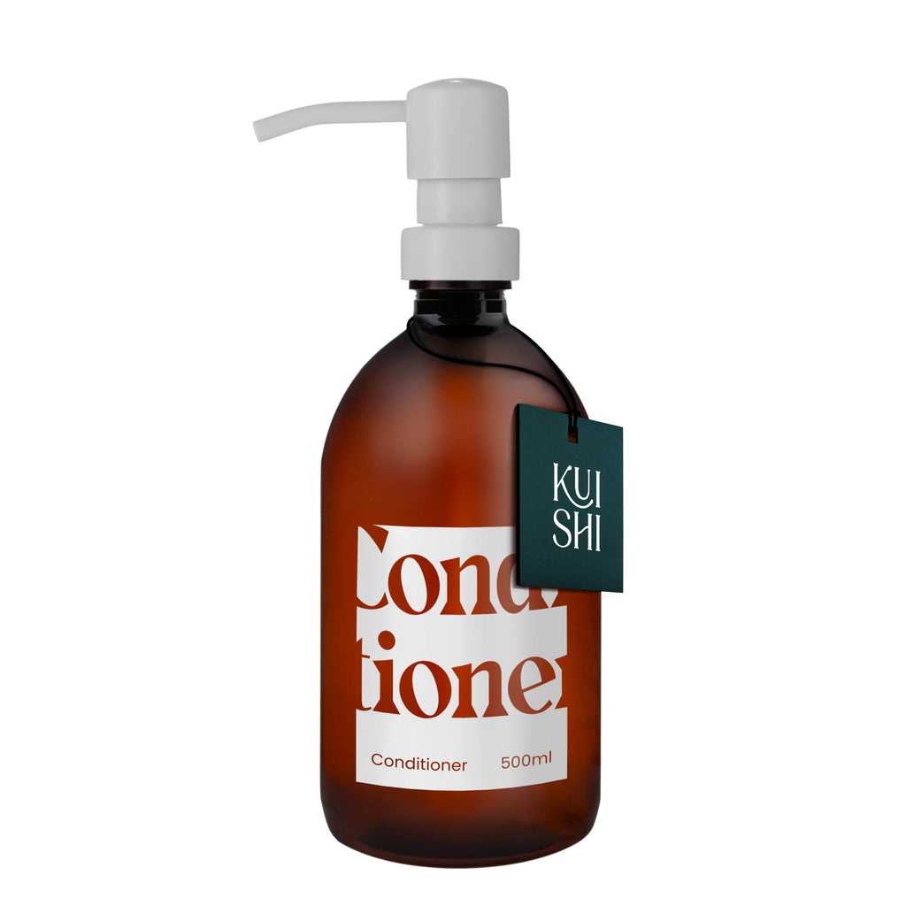 Brown conditioner bottle with pump and 'KUSHI' label on a white background