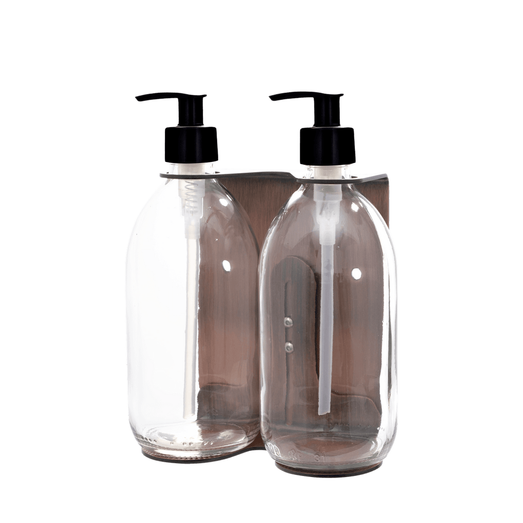 Clear soap dispenser bottles with black pumps on a transparent background