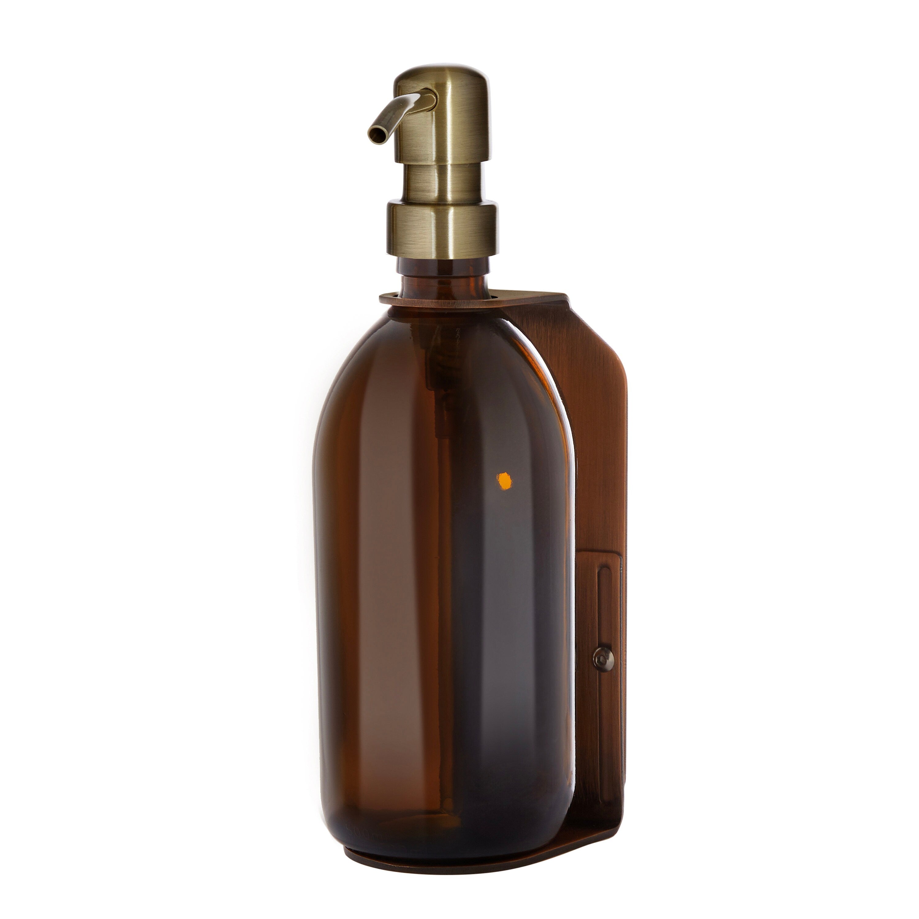 Brown glass bottle with a gold pump on a white background