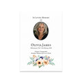 Memorial card with a photo of a woman and floral design on a white background