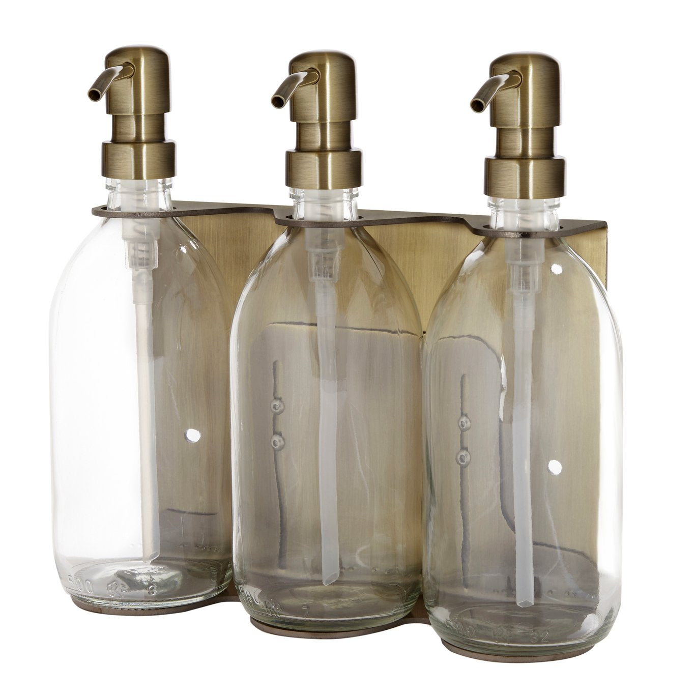 Three clear glass bottles with gold pumps on a white background