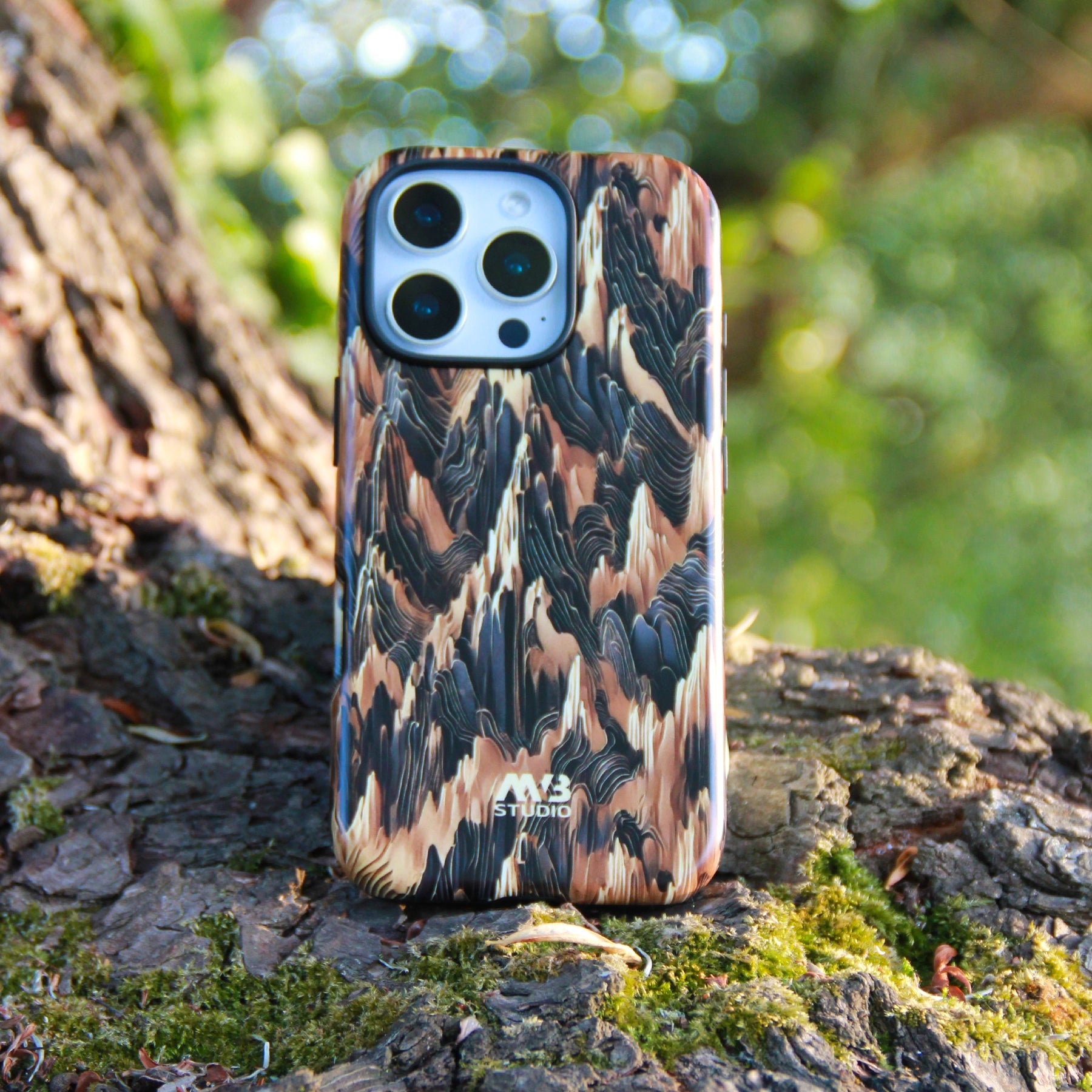 Phone case with camouflage pattern on a tree stump